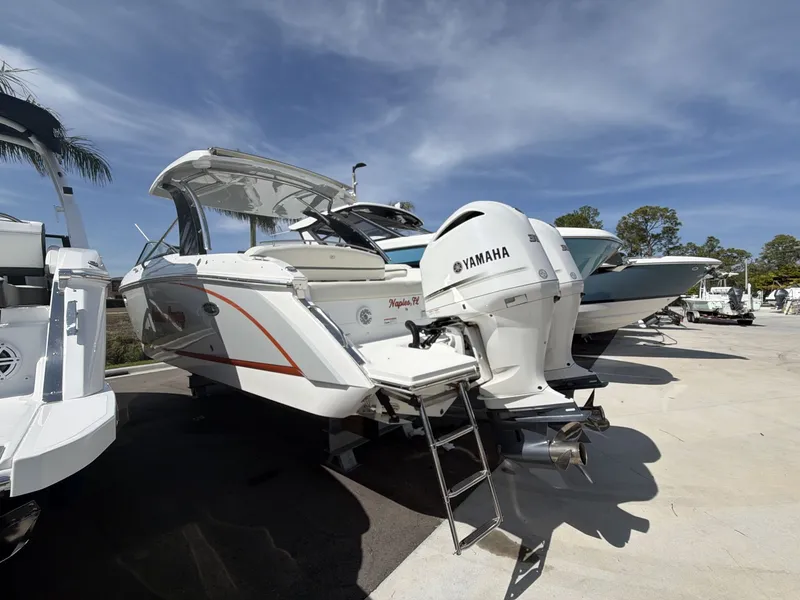 Slide: The Image of 2021 Cobalt 30SC boat with Yamaha engines displayed outdoors. - 5