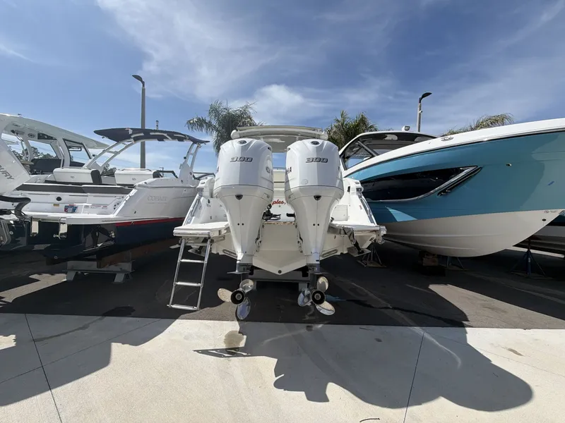 Slide: The Image of Cobalt 30SC 2021 boat with twin outboard engines in harbor. - 6