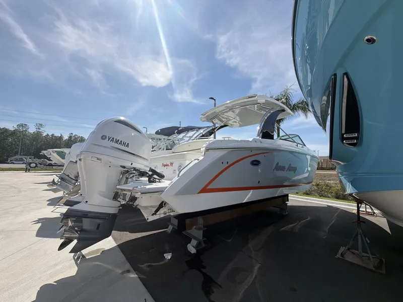 Slide: The Image of 2021 Cobalt 30SC boat with Yamaha engines outdoors. - 7