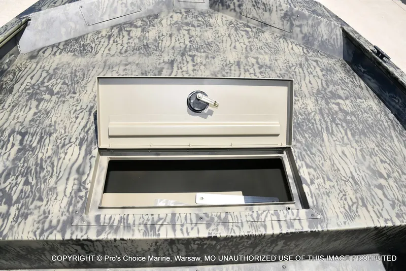 Slide: The Image of 2026 Tracker Grizzly 1860 Jon boat with open storage compartment. - 11