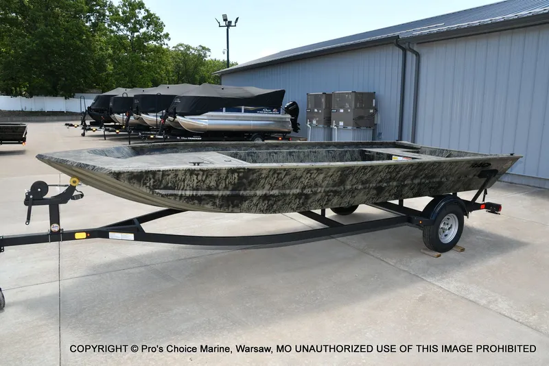 Slide: The Image of 2026 Tracker Grizzly 1860 Jon boat on trailer outdoors. - 21