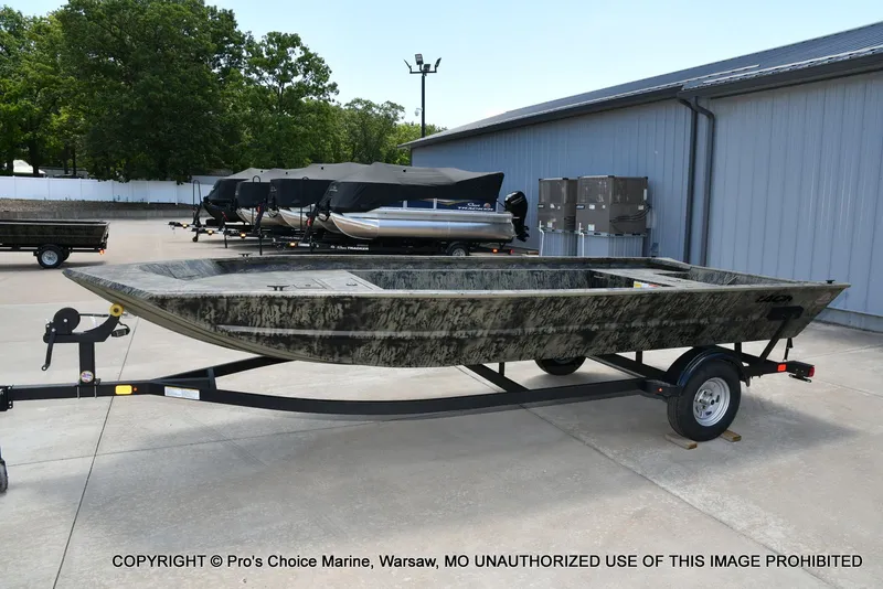 Slide: The Image of 2026 Tracker Grizzly 1860 Jon boat on trailer outdoors. - 22
