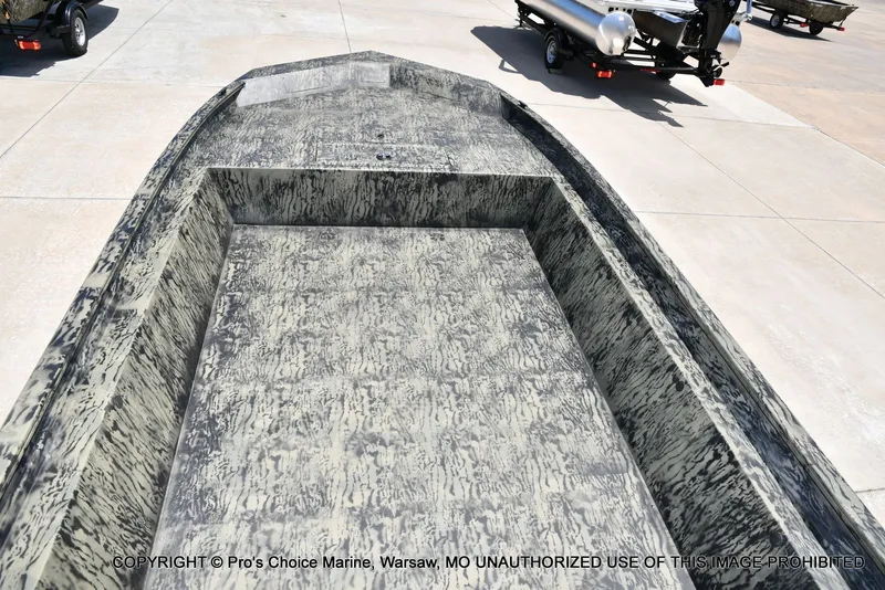 Slide: The Image of Tracker Grizzly 1860 Jon 2026 boat with camouflage pattern on trailer. - 34