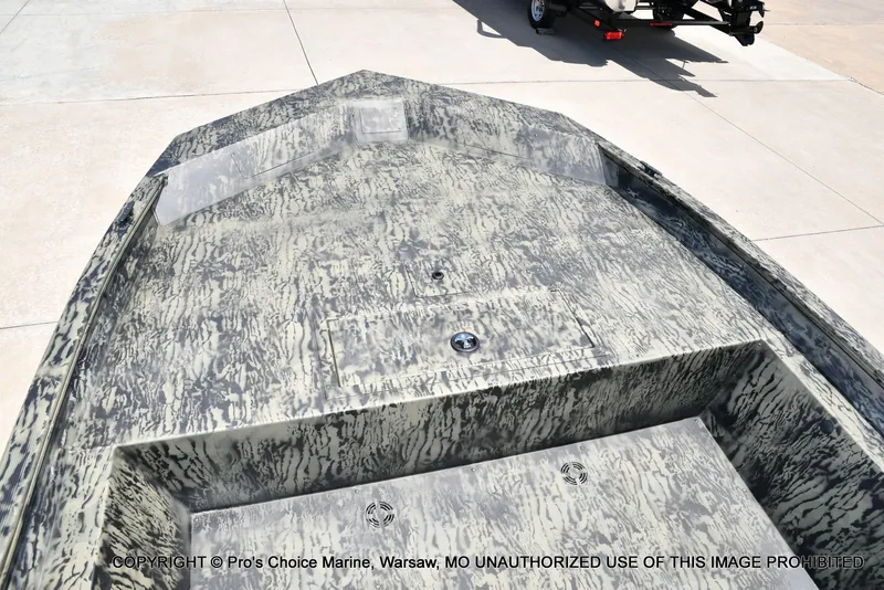 Slide: The Image of 2026 Tracker Grizzly 1860 Jon boat with camouflage pattern on trailer. - 35