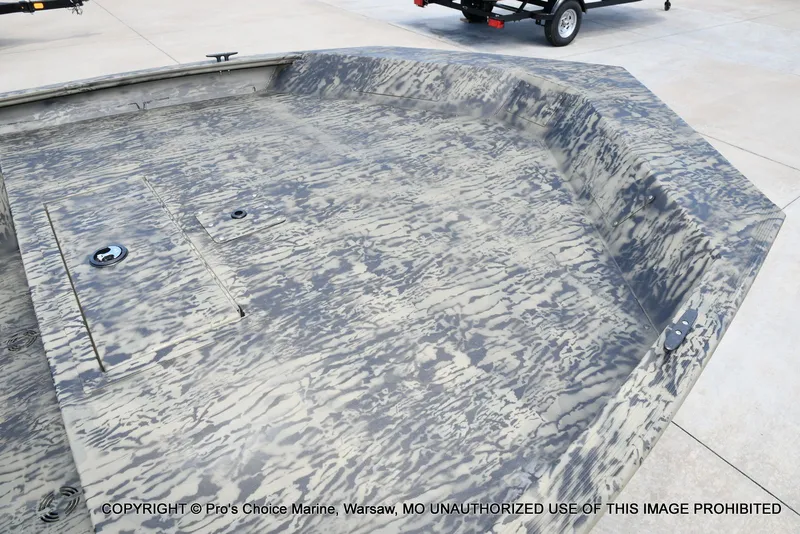 Slide: The Image of 2026 Tracker Grizzly 1860 Jon boat with camouflage pattern on trailer. - 8