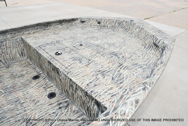 Slide: The Image of 2026 Tracker Grizzly 1860 CC boat with camouflage pattern. - 12