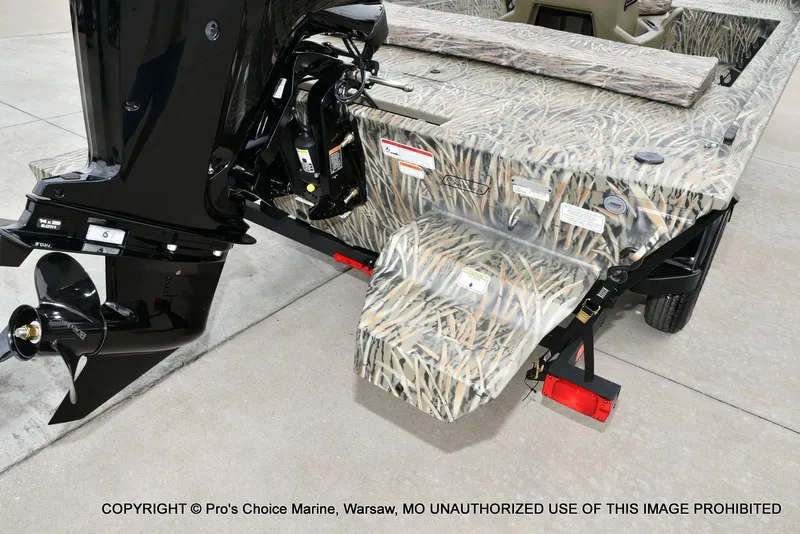 Slide: The Image of Tracker Grizzly 1860 CC 2026 with camo design and outboard motor. - 19