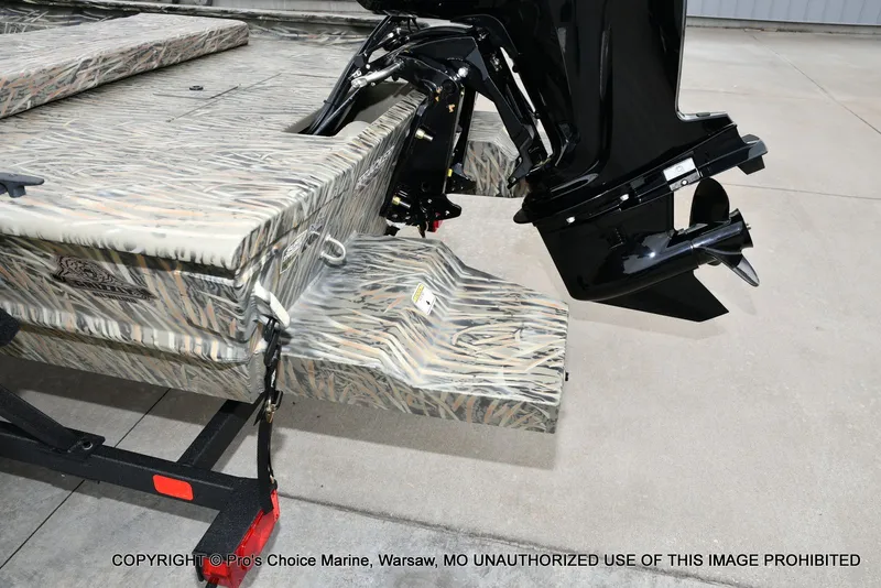 Slide: The Image of Tracker Grizzly 1860 CC 2026 with camo-patterned stern and outboard motor. - 20