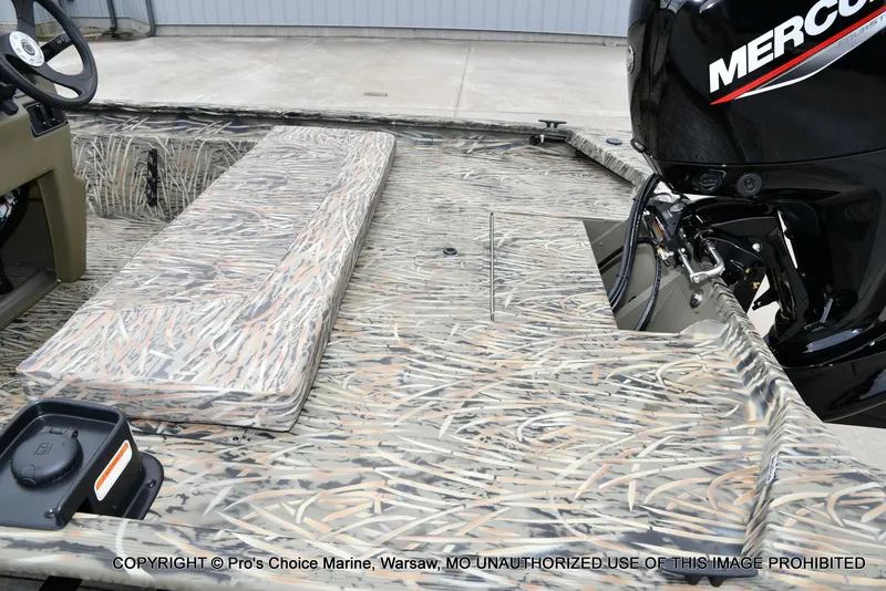 Slide: The Image of 2026 Tracker Grizzly 1860 CC boat with camouflage pattern and Mercury engine. - 31