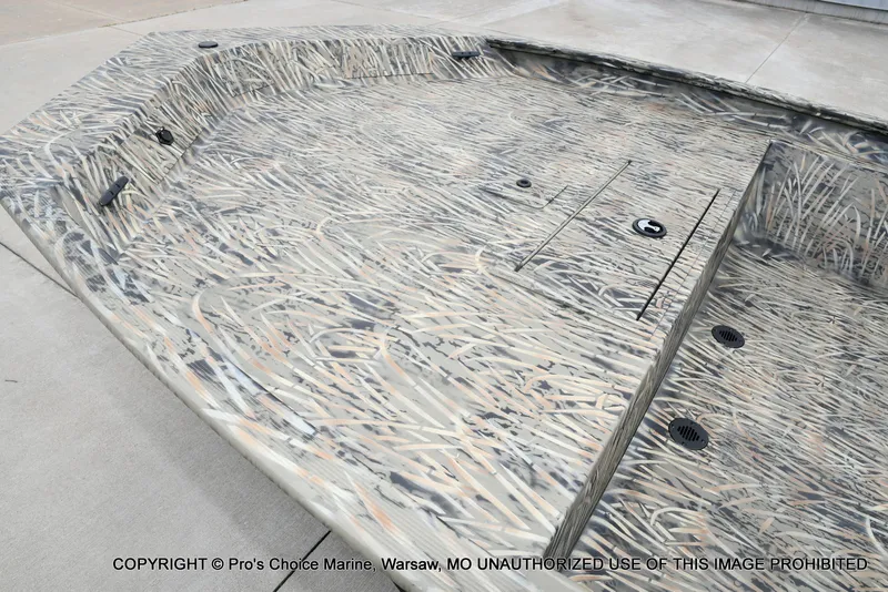 Slide: The Image of 2026 Tracker Grizzly 1860 CC boat with camouflage pattern design. - 32