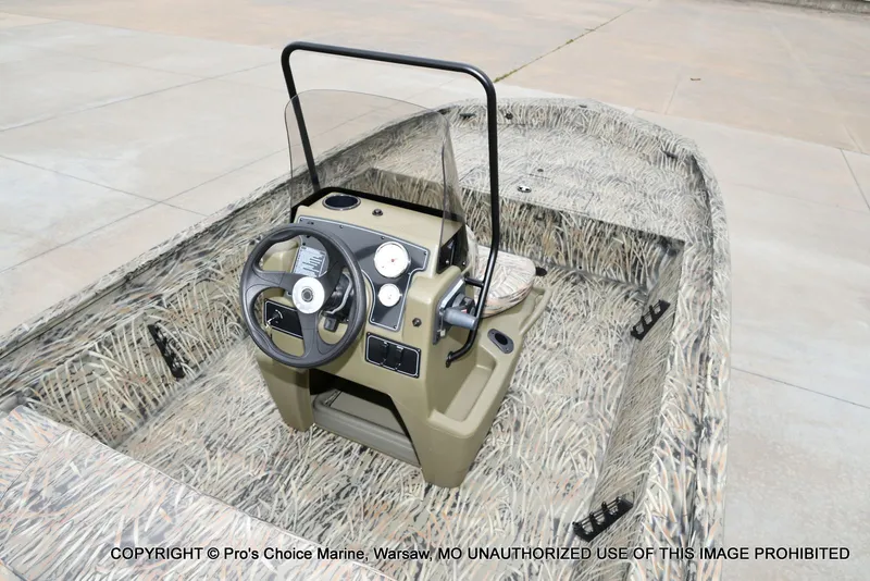 Slide: The Image of Tracker Grizzly 1860 CC 2026 with camouflage design and steering console. - 37