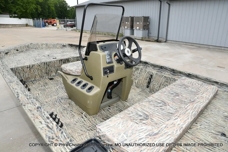 Slide: The Image of 2026 Tracker Grizzly 1860 CC boat with camouflage design. - 4