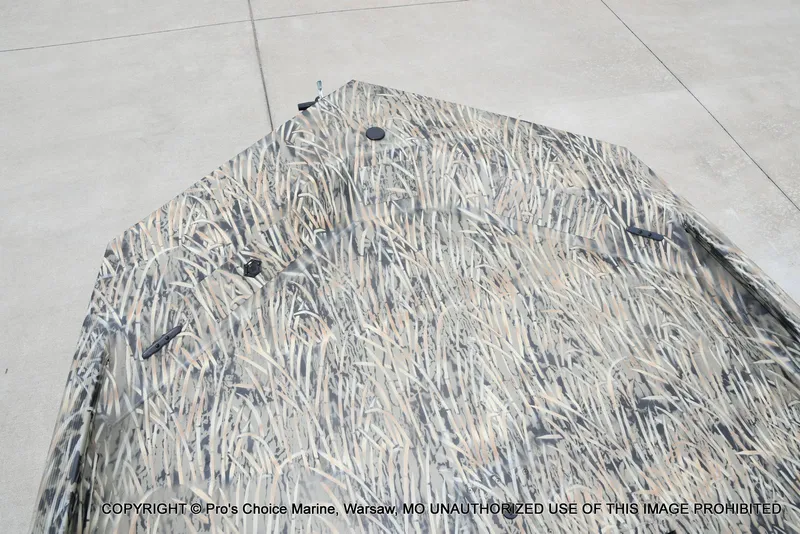 Slide: The Image of Tracker Grizzly 1860 CC 2026 with camouflage pattern on concrete surface. - 40