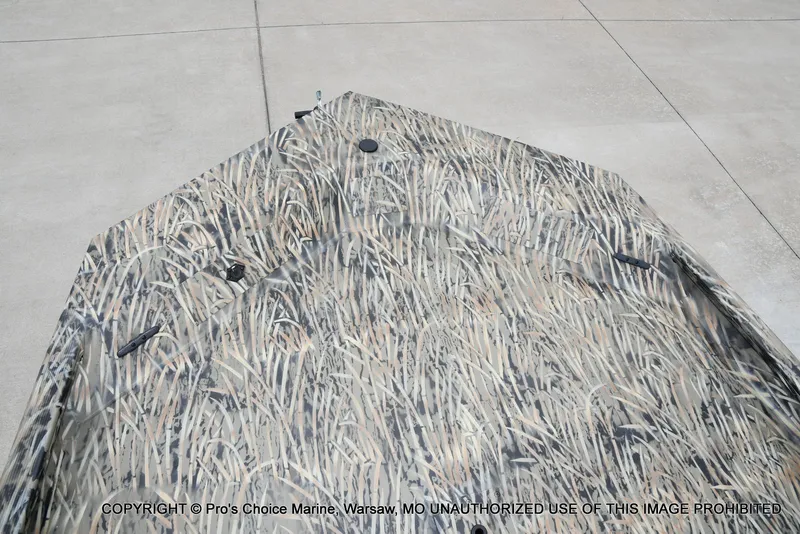 Slide: The Image of 2026 Tracker Grizzly 1860 CC with camouflage pattern on concrete floor. - 41