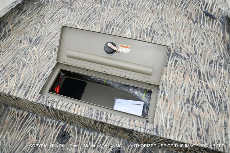 Slide: The Image of 2026 Tracker Grizzly 1860 CC boat with storage compartment. - 42