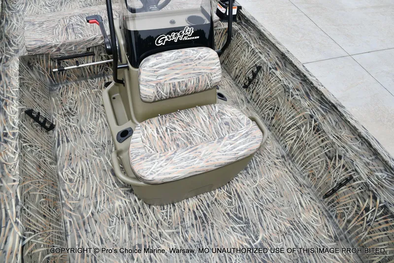 Slide: The Image of 2026 Tracker Grizzly 1860 CC with camouflage pattern and cushioned seat. - 45