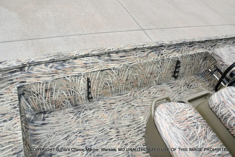 Slide: The Image of 2026 Tracker Grizzly 1860 CC with camouflage pattern design. - 47