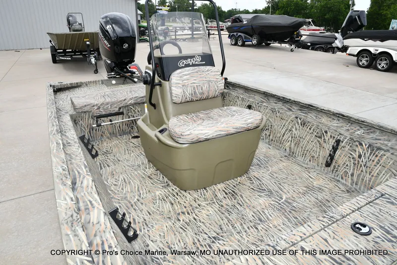 Slide: The Image of 2026 Tracker Grizzly 1860 CC boat with camouflage interior. - 6