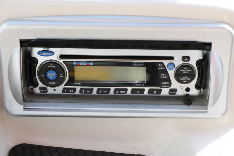 Slide: The Image of Jensen stereo system in 2010 Tahoe Q5i SF boat dashboard. - 19