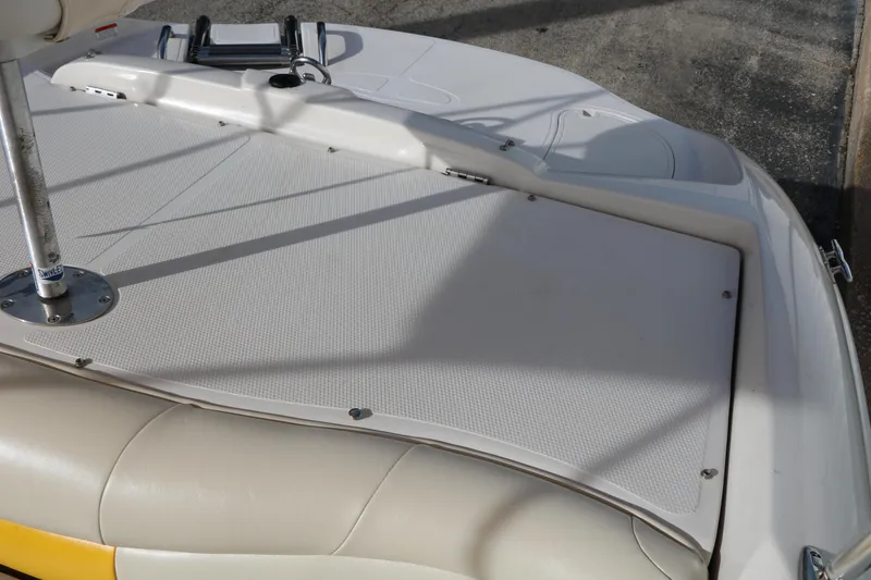 Slide: The Image of 2010 Tahoe Q5i SF boat deck with ladder and textured surface. - 25