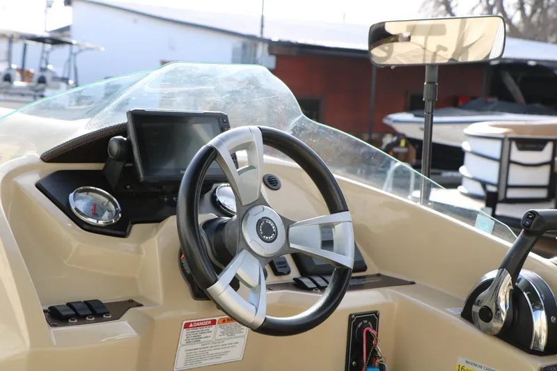 Slide: The Image of Steering console of 2016 Crest II 250 boat with gauges and controls. - 18