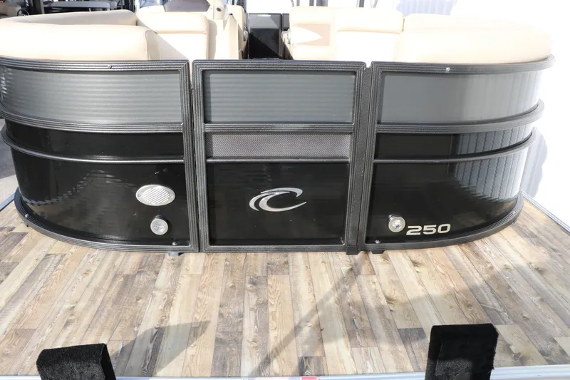 Slide: The Image of 2016 Crest II 250 pontoon boat with sleek black exterior on wooden dock. - 4