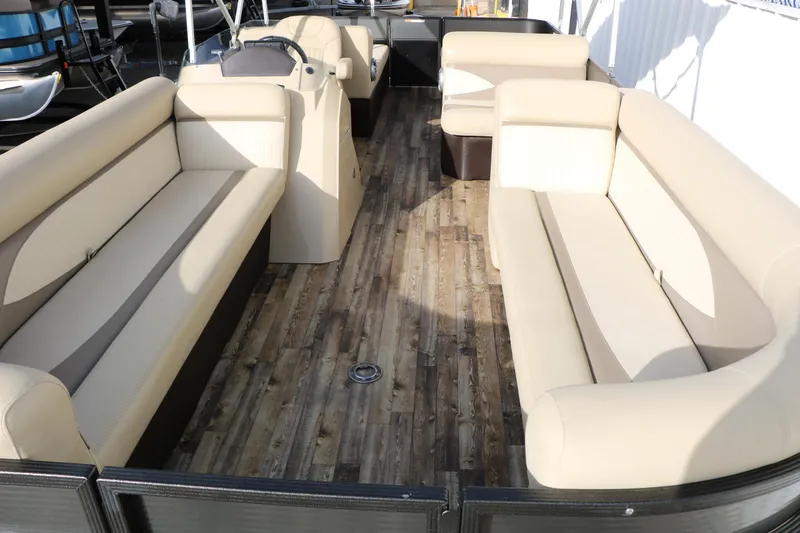 Slide: The Image of 2016 Crest II 250 pontoon boat with spacious seating and wood-style flooring. - 5
