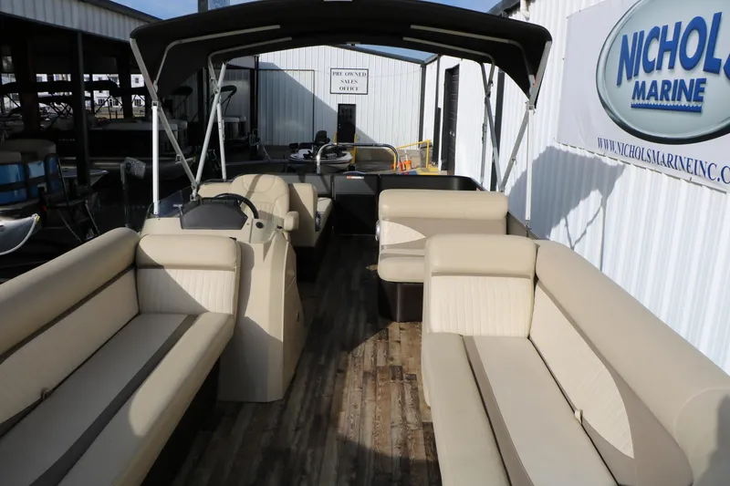 Slide: The Image of 2016 Crest II 250 pontoon boat with beige seating and canopy at Nichols Marine. - 6