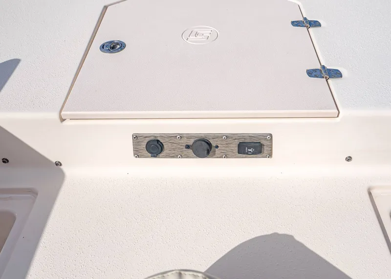 Slide: The Image of 2023 Carolina Skiff 17 LS boat deck with switch and storage hatch. - 18