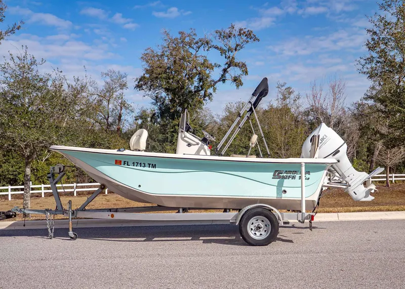 Slide: The Image of 2023 Carolina Skiff 17 LS boat on trailer, side view. - 2