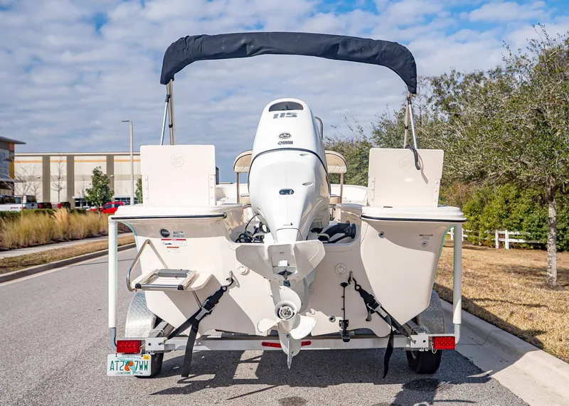 Slide: The Image of Rear view of a 2023 Carolina Skiff 17 LS boat on a trailer. - 4