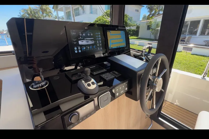 Slide: The Image of Helm of 2026 Cobra Yachts Seamaster 45 with advanced navigation controls and touchscreen display. - 12