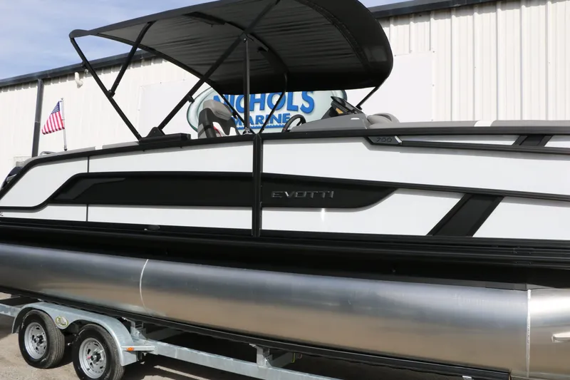 The Image of 2026 Evotti 723 QL Tri Toon boat on trailer. - 1