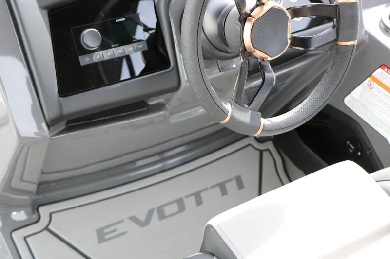 Slide: The Image of Interior of 2026 Evotti 723 QL Tri Toon with steering wheel and controls. - 36
