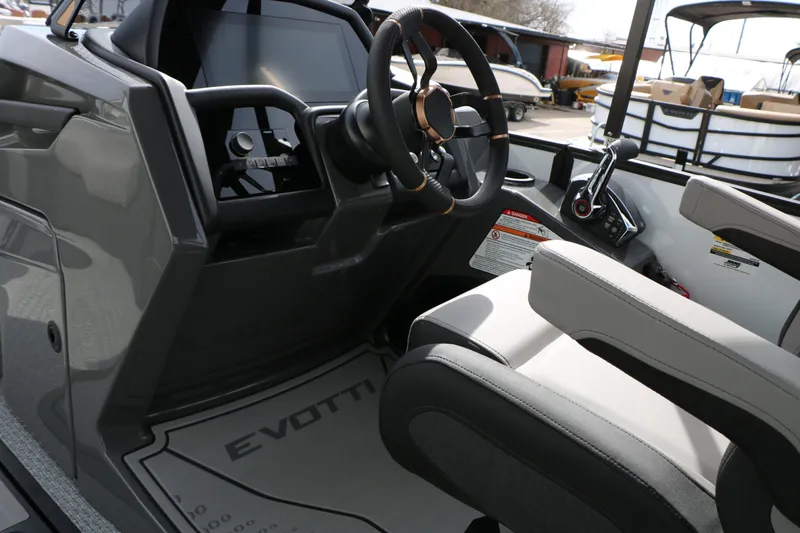 Slide: The Image of Interior of 2026 Evotti 723 QL Tri Toon with steering console. - 49