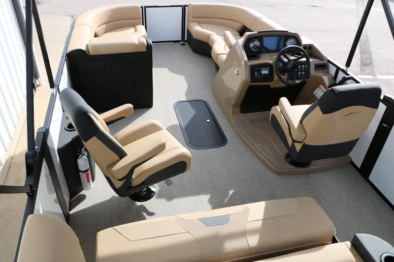Slide: The Image of Interior of 2026 Evotti 523 CS Tri Toon with beige seating. - 32