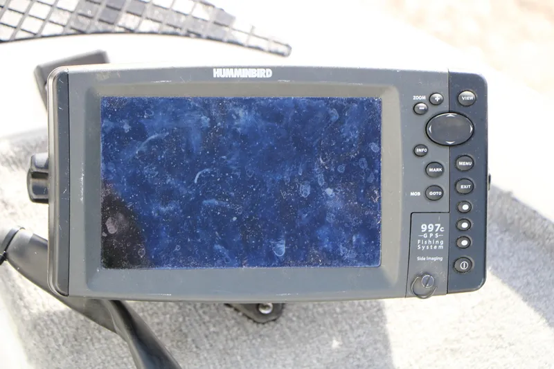 Slide: The Image of Humminbird 997c GPS Fishing System on 2009 Triton 18 Explorer boat. - 12