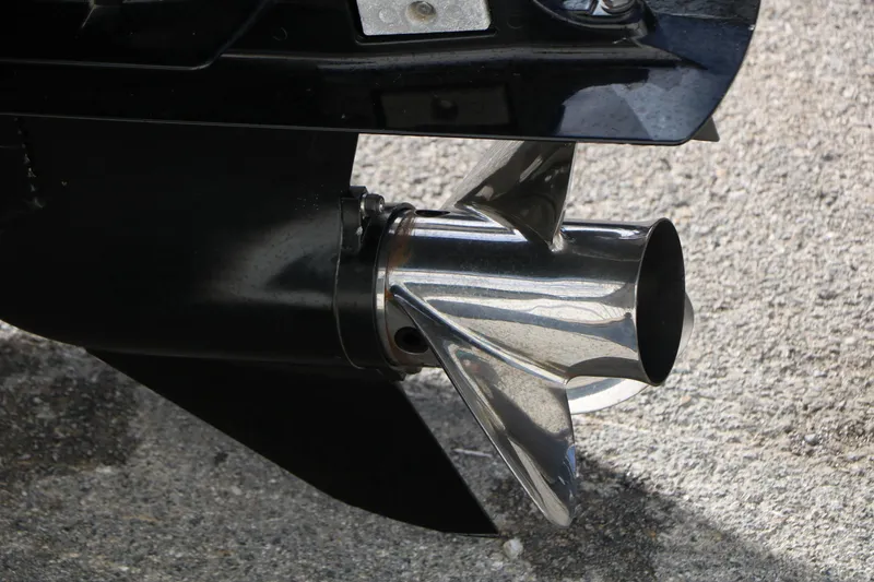 Slide: The Image of Close-up of a 2009 Triton 18 Explorer boat propeller on a concrete surface. - 22