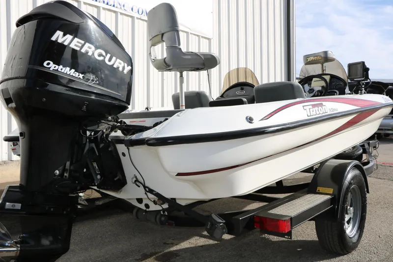 Slide: The Image of 2009 Triton 18 Explorer boat with Mercury OptiMax engine, parked on trailer. - 6