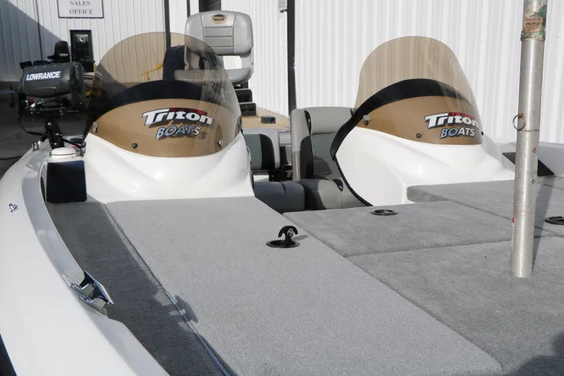 Slide: The Image of 2009 Triton 18 Explorer boat interior with dual windshields and Lowrance equipment. - 8