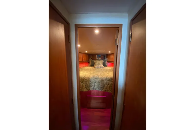 Slide: The Image of Interior view of 2001 Egg Harbor 37 Convertible yacht bedroom with elegant bedding. - 13