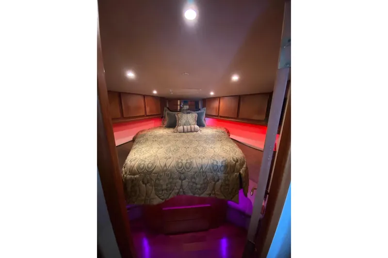 Slide: The Image of Luxurious bedroom interior of 2001 Egg Harbor 37 Convertible yacht with elegant bedding. - 14