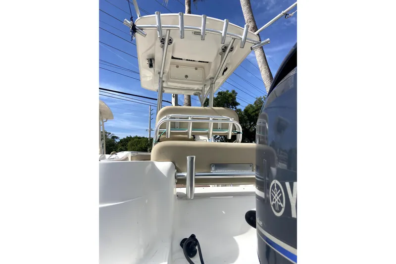 Slide: The Image of 2001 Egg Harbor 37 Convertible yacht docked, rear view with fishing equipment. - 2