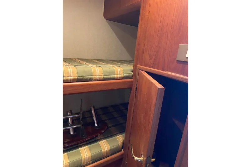Slide: The Image of Interior of 2001 Egg Harbor 37 Convertible with bunk beds and wooden cabinetry. - 21