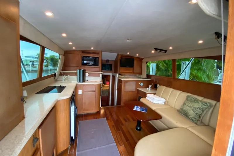 Slide: The Image of Luxurious interior of 2001 Egg Harbor 37 Convertible yacht with modern amenities and elegant design. - 25