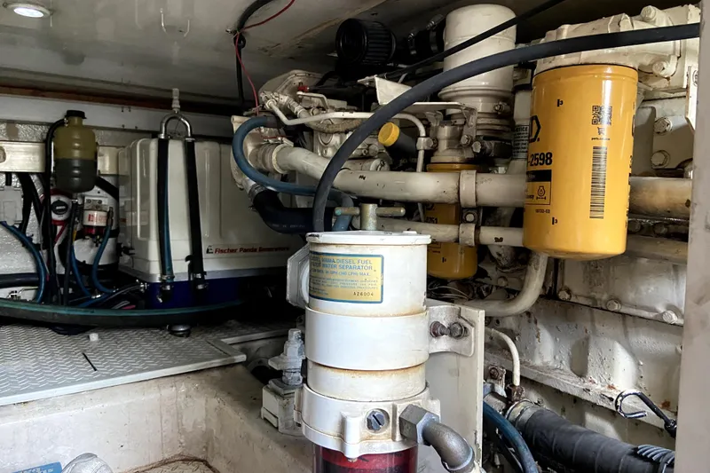 Slide: The Image of Engine room of 2001 Egg Harbor 37 Convertible with visible fuel and filtration systems. - 29