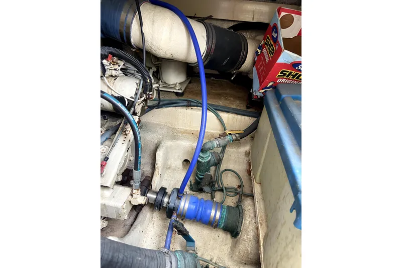 Slide: The Image of Engine room of 2001 Egg Harbor 37 Convertible with visible hoses and components. - 30