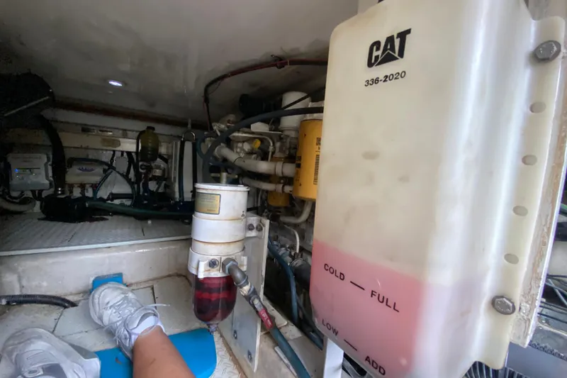 Slide: The Image of Engine room of 2001 Egg Harbor 37 Convertible with CAT components and maintenance equipment. - 32