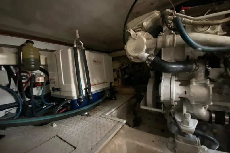 Slide: The Image of Engine room of 2001 Egg Harbor 37 Convertible boat, featuring machinery and components. - 36