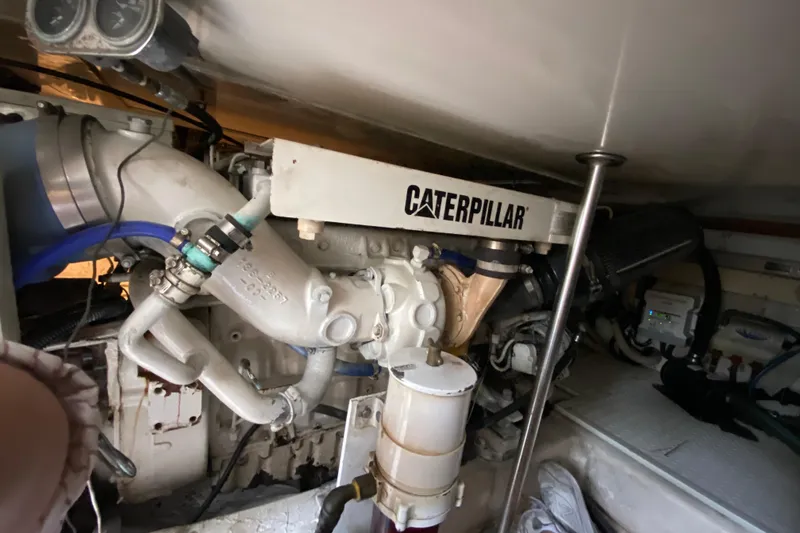 Slide: The Image of Engine room of 2001 Egg Harbor 37 Convertible with Caterpillar engine components. - 38